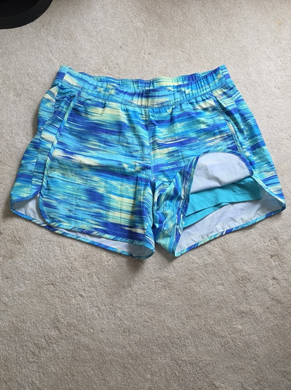 Lane Bryant Livi Active shorts feature a blue and green Multi-Stripe W-386